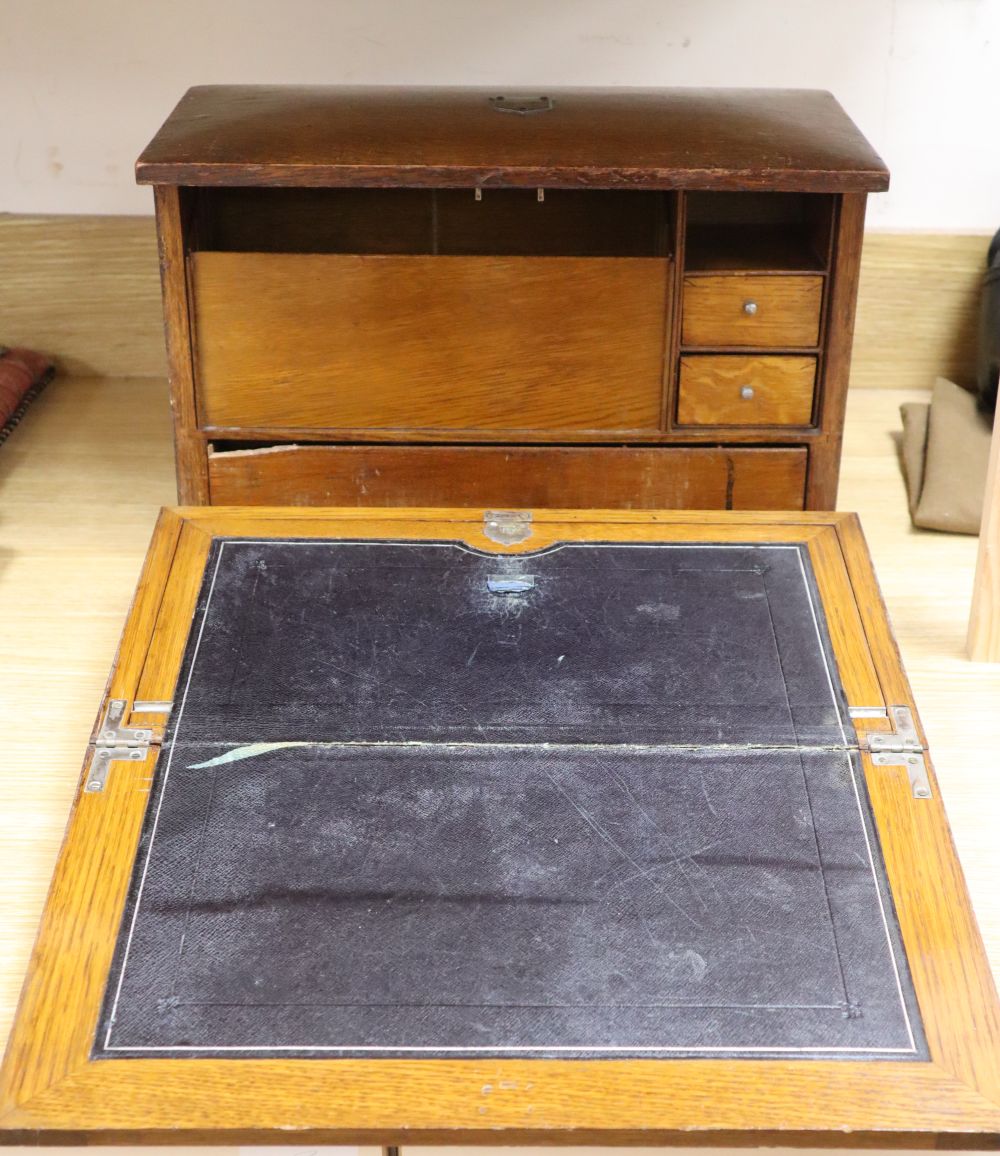 An oak fall-front portable desk